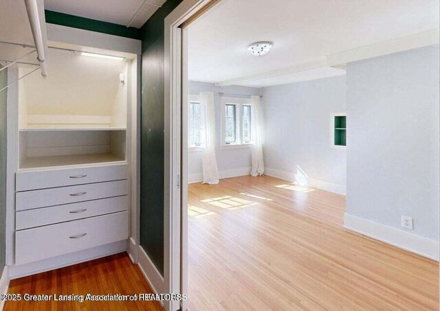1046 Cresenwood Rd, East Lansing, MI 48823 - walk in closet featuring wood finished floors