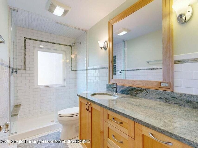 1046 Cresenwood Rd, East Lansing, MI 48823 - full bath with tile walls, vanity, and a stall shower