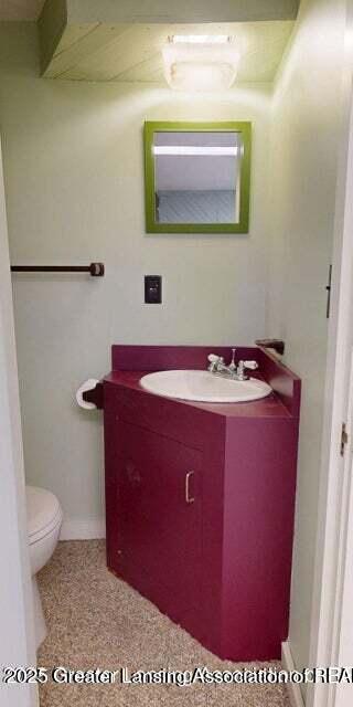 1046 Cresenwood Rd, East Lansing, MI 48823 - half bath with vanity and toilet
