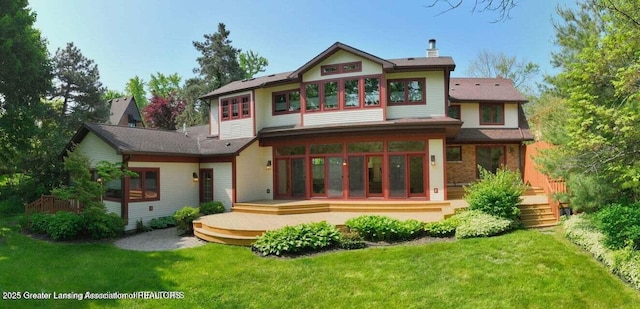 1046 Cresenwood Rd, East Lansing, MI 48823 - back of property featuring a deck, a lawn, a chimney, and a sunroom