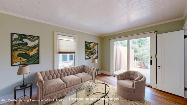 1046 Cresenwood Rd, East Lansing, MI 48823 - living area featuring crown molding and light wood-style floors
