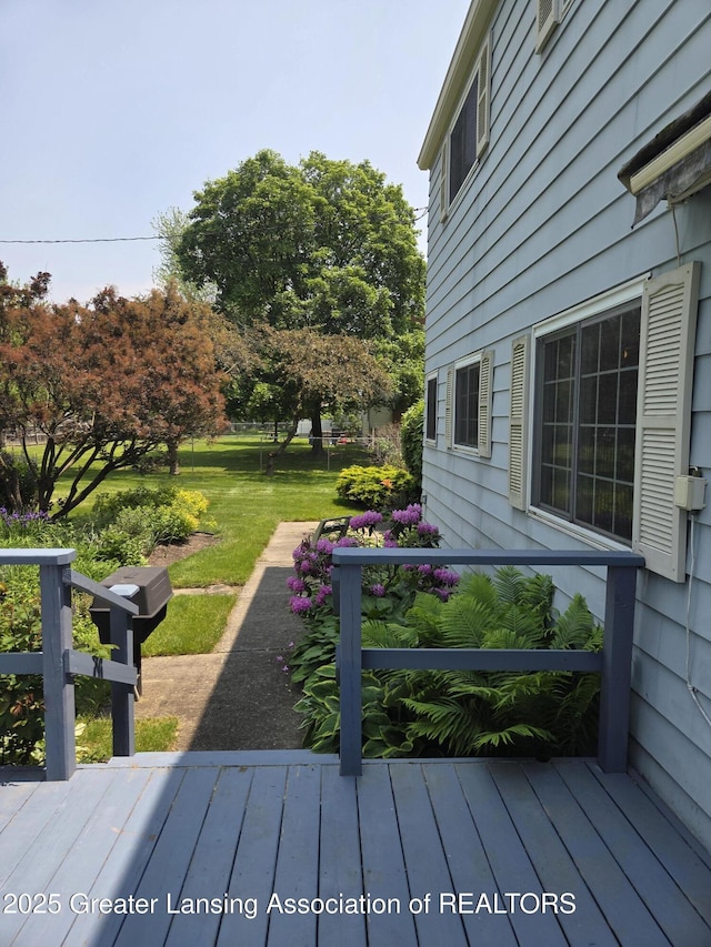 2115 Lyman Dr, Lansing, MI 48912 - wooden terrace with a yard