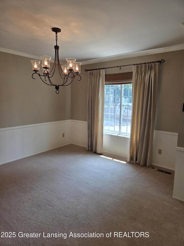 2115 Lyman Dr, Lansing, MI 48912 - unfurnished room with crown molding, a chandelier, and carpet flooring