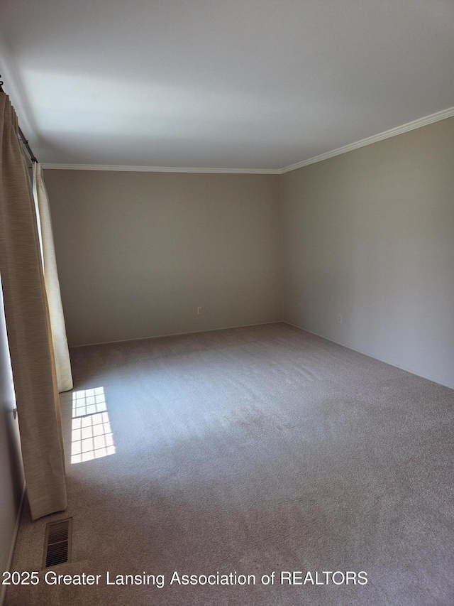 2115 Lyman Dr, Lansing, MI 48912 - carpeted empty room with ornamental molding