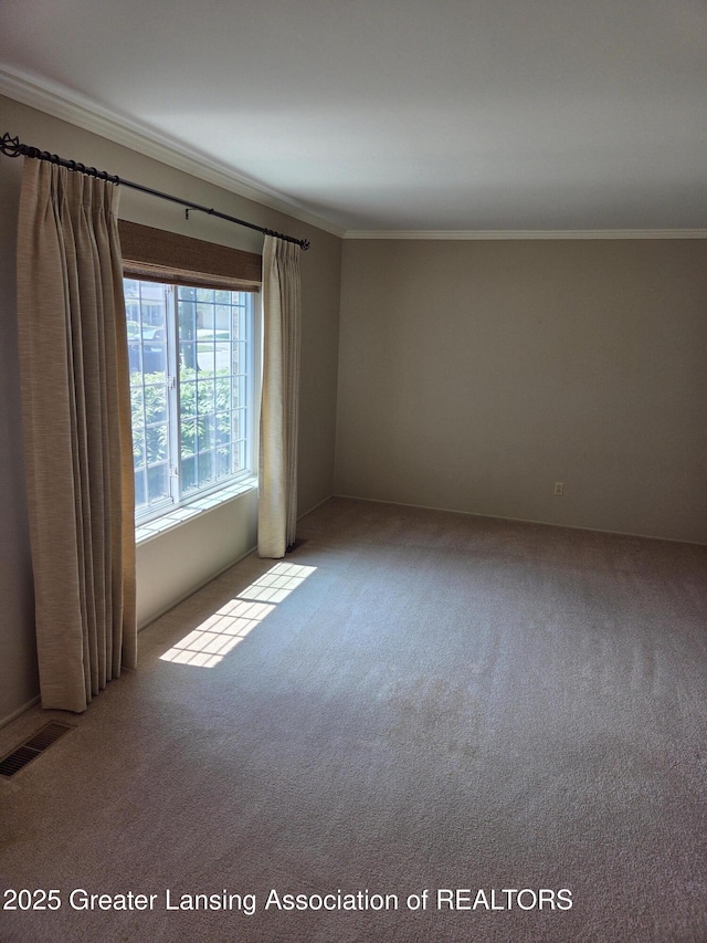 2115 Lyman Dr, Lansing, MI 48912 - carpeted empty room featuring ornamental molding
