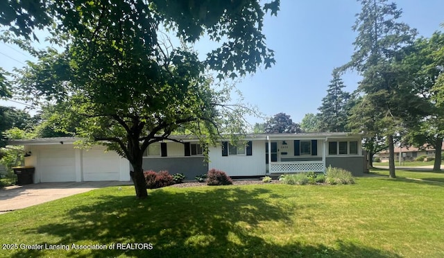 2404 Hopkins Ave, Lansing, MI 48912 - ranch-style home with a front lawn, driveway, and a garage