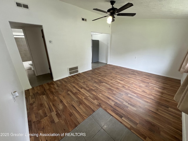 4219 Richmond St, Lansing, MI 48911 - empty room with wood finished floors, a ceiling fan, and baseboards