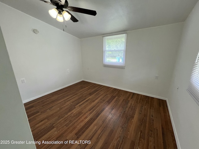 4219 Richmond St, Lansing, MI 48911 - empty room with dark wood-style flooring, baseboards, and a ceiling fan