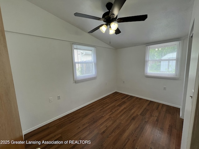 4219 Richmond St, Lansing, MI 48911 - spare room with plenty of natural light, lofted ceiling, wood finished floors, baseboards, and a ceiling fan