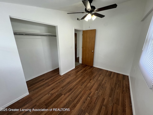4219 Richmond St, Lansing, MI 48911 - unfurnished bedroom featuring wood finished floors, a closet, baseboards, and ceiling fan