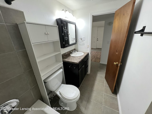 4219 Richmond St, Lansing, MI 48911 - bathroom featuring toilet, vanity, and tile patterned flooring