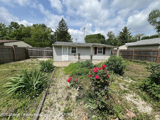 4219 Richmond St, Lansing, MI 48911 - rear view of house featuring a fenced backyard