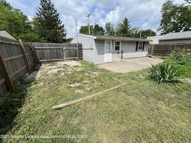 4219 Richmond St, Lansing, MI 48911 - back of house with a patio and a gate