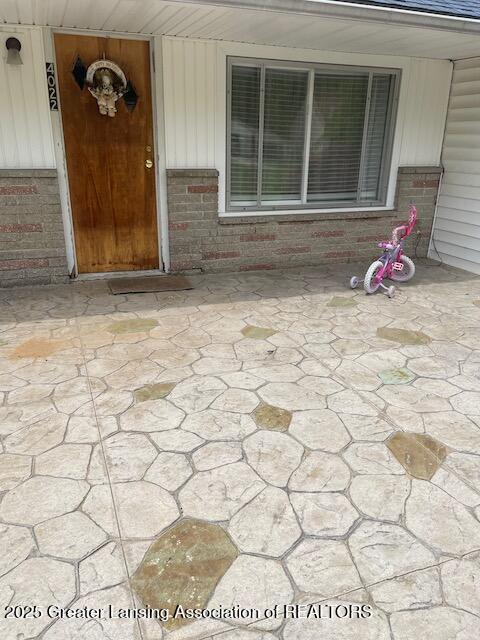 4022 Stabler St, Lansing, MI 48910 - entrance to property featuring brick siding