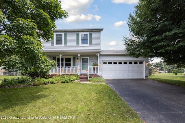 202 Kerry St, Eaton Rapids, MI 48827 - traditional-style home with a porch, driveway, a garage, and a front lawn