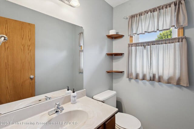 202 Kerry St, Eaton Rapids, MI 48827 - bathroom featuring toilet and vanity