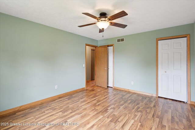 202 Kerry St, Eaton Rapids, MI 48827 - unfurnished bedroom featuring wood finished floors and a ceiling fan