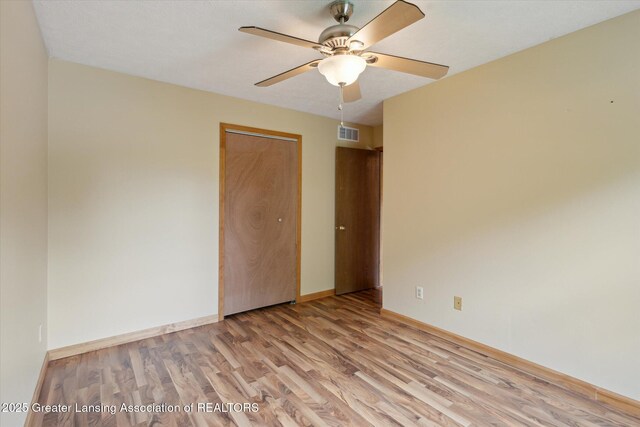 202 Kerry St, Eaton Rapids, MI 48827 - unfurnished room with wood finished floors and a ceiling fan