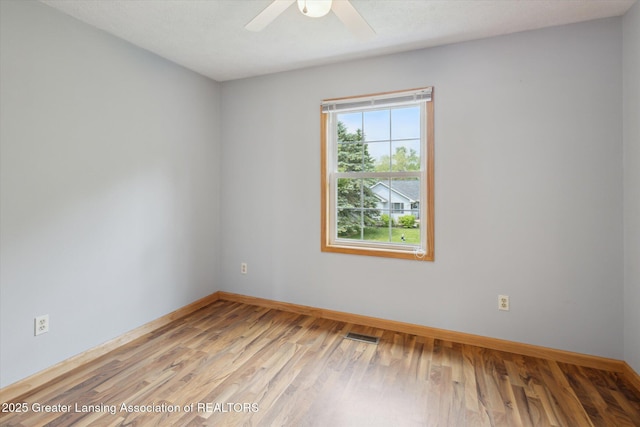 202 Kerry St, Eaton Rapids, MI 48827 - unfurnished room featuring wood finished floors and ceiling fan