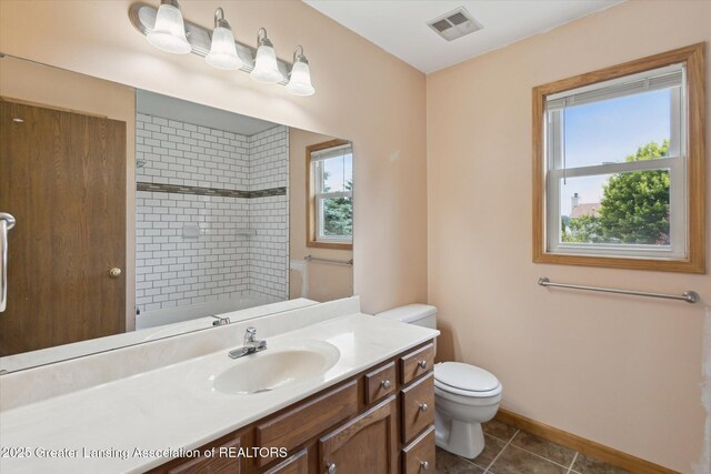 202 Kerry St, Eaton Rapids, MI 48827 - bathroom with vanity, a shower, and tile patterned flooring