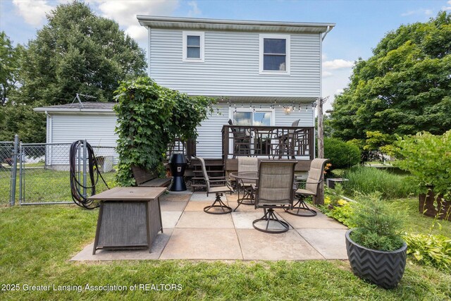 202 Kerry St, Eaton Rapids, MI 48827 - rear view of house with a patio area and outdoor dining area