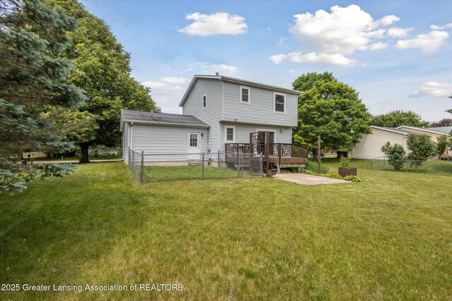 202 Kerry St, Eaton Rapids, MI 48827 - rear view of property featuring a wooden deck and a patio