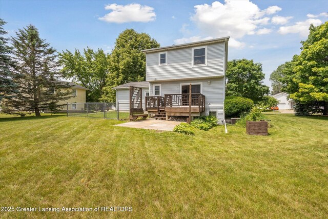 202 Kerry St, Eaton Rapids, MI 48827 - back of house featuring a deck and a patio