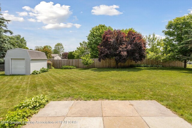 202 Kerry St, Eaton Rapids, MI 48827 - fenced backyard with a storage shed and a patio