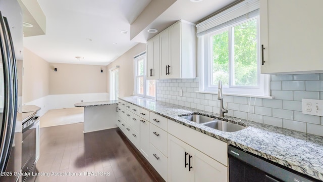 1965 Rutgers Cir, East Lansing, MI 48823 - kitchen with white cabinets, freestanding refrigerator, white electric stove, dark wood-style flooring, and backsplash