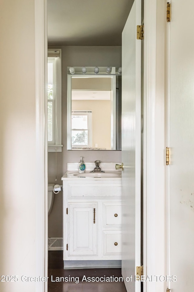 1965 Rutgers Cir, East Lansing, MI 48823 - bathroom with vanity and toilet
