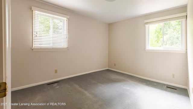 1965 Rutgers Cir, East Lansing, MI 48823 - unfurnished room with baseboards and carpet floors