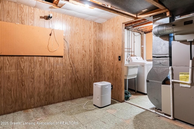 1965 Rutgers Cir, East Lansing, MI 48823 - unfinished below grade area with wooden walls, washing machine and clothes dryer, and heating unit