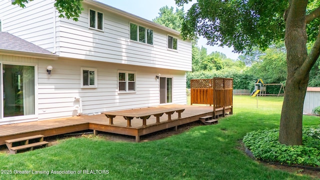 1965 Rutgers Cir, East Lansing, MI 48823 - rear view of property with a playground and a wooden deck