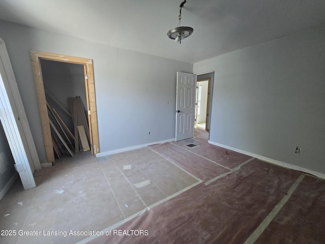 749 N Larch St, Lansing, MI 48906 - unfurnished bedroom with baseboards