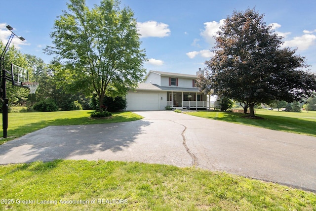 921 Ives Rd, Mason, MI 48854 - view of front of property featuring a chimney, a front lawn, a porch, and an attached garage