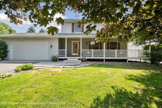 921 Ives Rd, Mason, MI 48854 - view of front of property with driveway, a garage, a front lawn, and covered porch