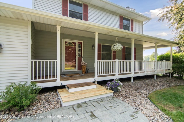 921 Ives Rd, Mason, MI 48854 - property entrance featuring a porch