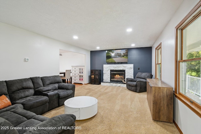 921 Ives Rd, Mason, MI 48854 - living room featuring light carpet, a fireplace, and recessed lighting