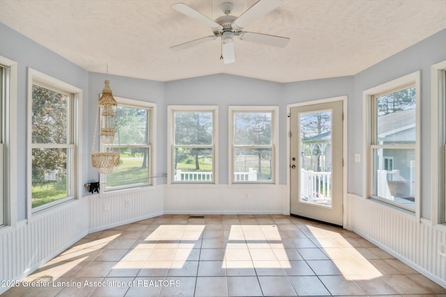 921 Ives Rd, Mason, MI 48854 - unfurnished sunroom with tile patterned flooring and a textured ceiling