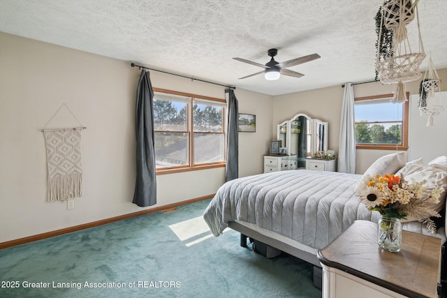 921 Ives Rd, Mason, MI 48854 - carpeted bedroom with baseboards, a textured ceiling, and ceiling fan