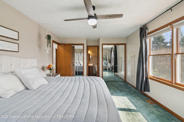 921 Ives Rd, Mason, MI 48854 - bedroom featuring a textured ceiling, carpet flooring, baseboards, multiple closets, and ceiling fan