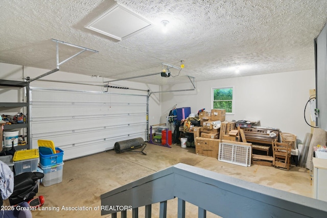 921 Ives Rd, Mason, MI 48854 - garage featuring a garage door opener