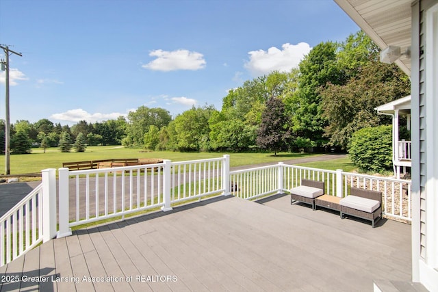 921 Ives Rd, Mason, MI 48854 - deck featuring a yard and view of scattered trees