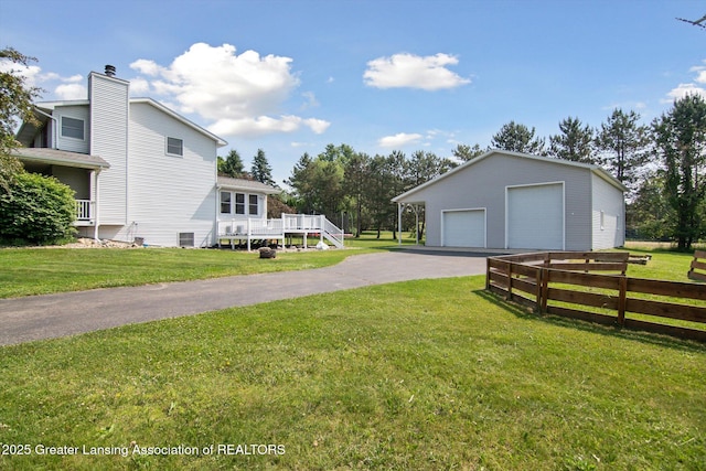 921 Ives Rd, Mason, MI 48854 - view of yard with a garage and an outdoor structure