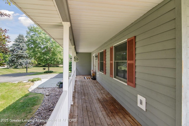 921 Ives Rd, Mason, MI 48854 - porch featuring a lawn