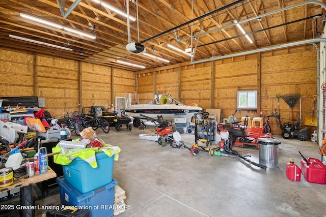 921 Ives Rd, Mason, MI 48854 - garage with a garage door opener