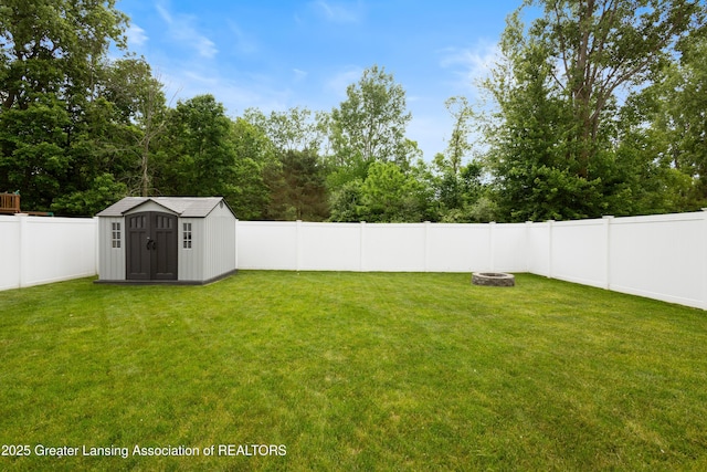 15925 Turnberry St, Lansing, MI 48906 - fenced backyard with a fire pit and a shed