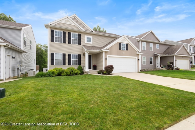 15925 Turnberry St, Lansing, MI 48906 - view of front of home with driveway, a front lawn, and board and batten siding