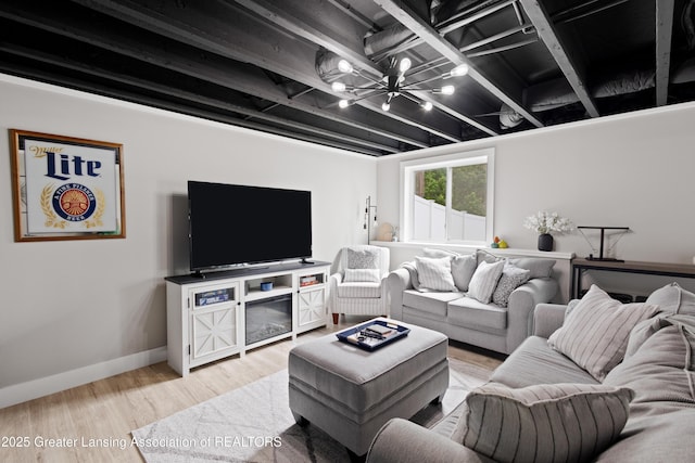 15925 Turnberry St, Lansing, MI 48906 - living area featuring wood finished floors and a chandelier