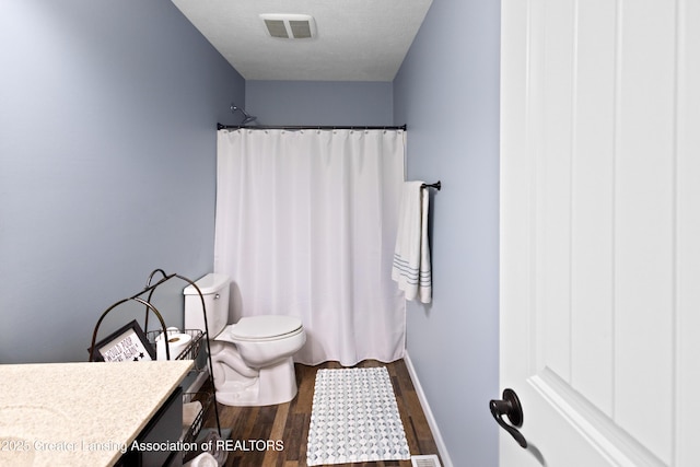 15925 Turnberry St, Lansing, MI 48906 - bathroom featuring vanity, wood finished floors, and curtained shower